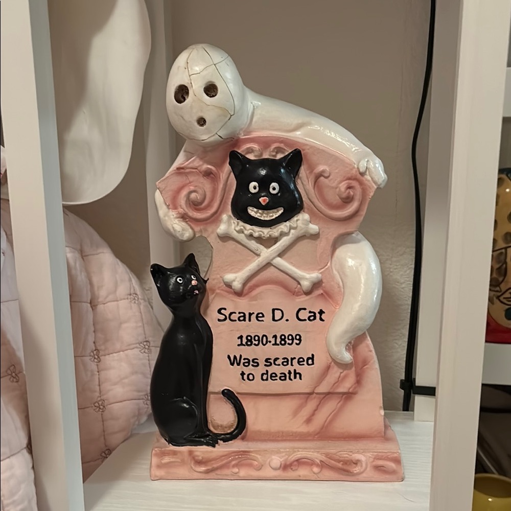 Pink Halloween tombstone with cat